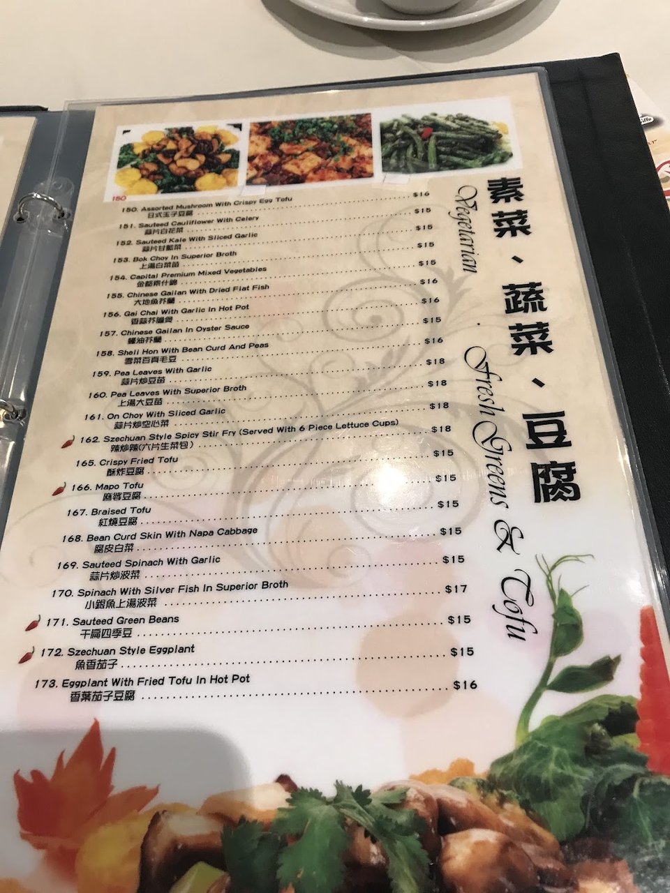 Printed menu highlighting rice noodles and live seafood.